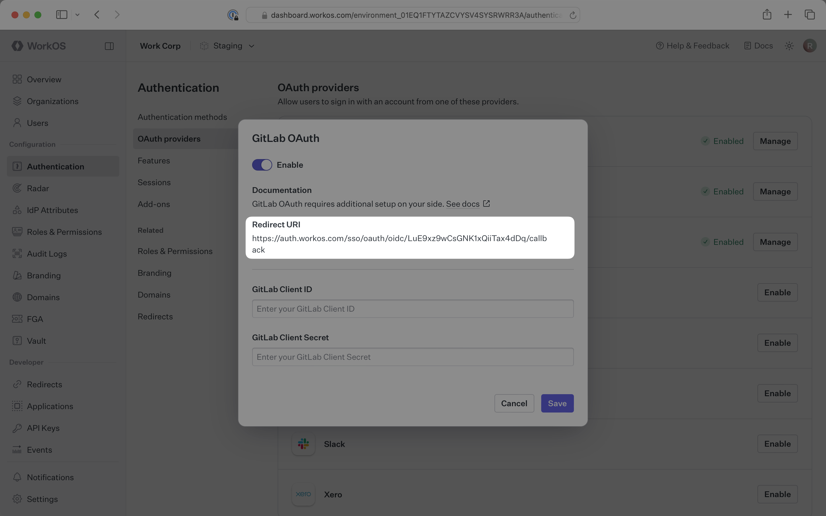 The GitLab OAuth configuration modal in the WorkOS Dashboard
