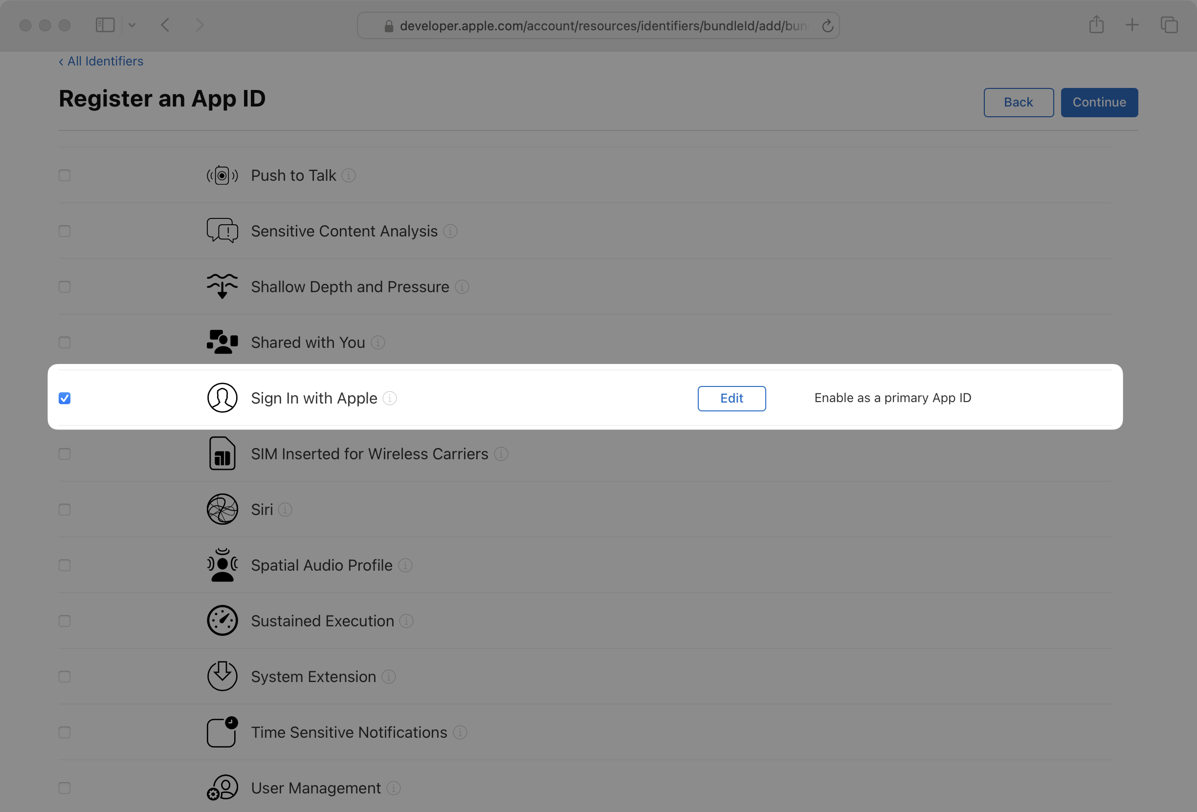 Third step in the Identifier creation wizard with Sign in with Apple checkbox checked.