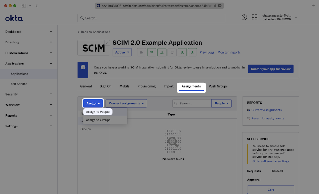 A screenshot showing where to select "Assign to People" in the "Assign" dropdown in the "Assignments" tab in Okta.