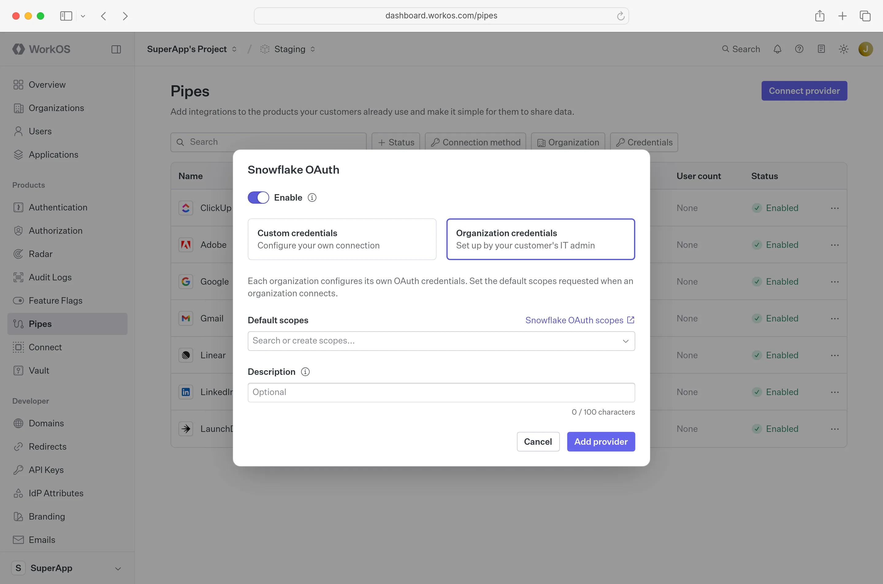A provider’s OAuth dialog in the WorkOS Dashboard with Customer credentials selected, showing default scopes and a description field, where each organization supplies its own OAuth credentials.